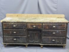 CIRCA 1850 PINE DRESSER BASE having seven drawers with central lower cupboard door with inverted