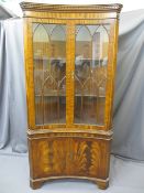 REPRODUCTION MAHOGANY CONCAVE FRONT DISPLAY CABINET with arched beading to the twin upper glazed