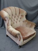 BUTTON BACK UPHOLSTERED REPRODUCTION ANTIQUE STYLE ARMCHAIR with curl over arms and brass front