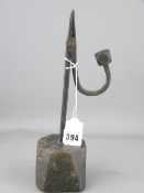 CIRCA 1820 WROUGHT IRON RUSH LIGHT NIP simple form with facet type counter weight on a stained