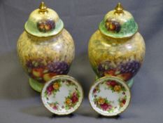 DOUG HAGUE a pair of apple and grapes lidded vases and Old Country Roses, a pair of display plates