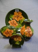 MOORCROFT - Hibiscus Green, four items including plate, 22cms diameter and a waisted neck vase,