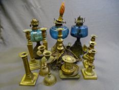 VINTAGE OIL LAMPS, three iron based, assortment of brass candlesticks and similar items