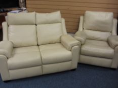 PARKER KNOLL CREAM LEATHER TWO-PIECE LOUNGE SUITE of two seater settee and matching armchair, 140