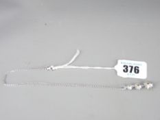 18CT WHITE GOLD TRIPLE GRADUATED FLORAL PENDANT, diamond set with fine link chain having a diamond