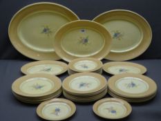 CLARICE CLIFF - FOR WILKINSON POTTERY DINNER & TABLE PLATES to include five oval platters, 12 x 25.