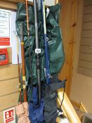 THREE FISHING RODS, walking sticks, brass reading lamp ETC