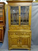 ANTIQUE WELSH OAK BOOKCASE CUPBOARD with upper glazed doors, a row of three spice drawers to the