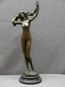 BRONZE FIGURINE AFTER JEAN PATOU, inscribed, of a lady on a circular base, overall height 38.5cms