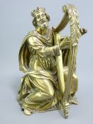GOOD CAST BRASS FIGURINE of a crowned seated man playing a harp, 29cms H overall (harp requires re-