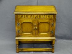 POLISHED HUTCH CUPBOARD with twin opening cupboard doors and upper drawer, 60cms H, 53cms W, 27cms