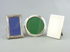 THREE EASEL BACK SILVER PHOTOGRAPH FRAMES, Birmingham hallmarks 1902, 15cms diameter, 1918, 15 x