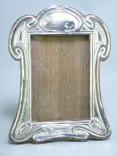 SILVER EASEL PICTURE FRAME of scrolled and shaped form, Birmingham 1906, 13 x 9cms (5 x 3.5in)