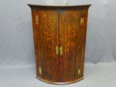 OAK BOW FRONTED WALL HANGING CORNER CUPBOARD, 107.5cms H, 78cms W