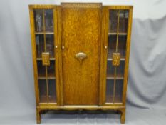 POLISHED BOOKCASE, central door with carved motif and flanked by two glazed doors, 140cms H,