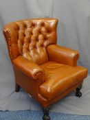 LEATHER BUTTON & WINGBACKED TYPE ARMCHAIR, medium tan in colour