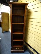 MODERN EASTERN NARROW BOOKCASE with adjustable shelves and lower drawer, 180cms H, 50cms W, 36cms D