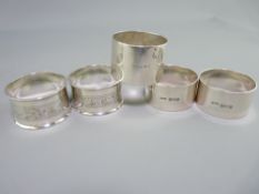 TWO PAIRS OF SILVER NAPKIN RINGS and one other, Chester and Birmingham hallmarks, all 1920s dates,