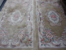 TWO CHINESE WASHED WOOLEN RUGS, green ground with floral pattern centres, approximate measurements