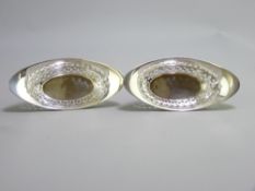 EDINBURGH SILVER PIERCED BON BON DISHES, a pair, maker Hamilton and Inches, 11.5cms L, 1.9 troy