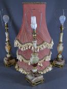 THREE STYLISH ONYX & BRASS TABLE LAMPS with tasselled shades