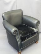 MODERN TUB TYPE ARMCHAIR in black leather effect and velour cushion