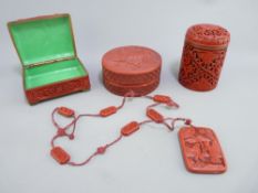 THREE CARVED CINNABAR TYPE LIDDED CONTAINERS and a necklace, various measurements