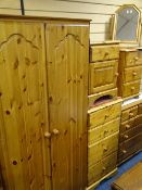 MODERN PINE BEDROOM FURNITURE comprising two bedside chests, a narrow chest of four drawers, another