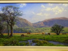 PHILLIP STANTON oil on canvas - titled 'Grazing in the Valley, Caernarfon', signed, 49.5 x 85cms