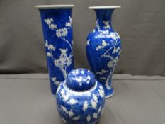 CHINESE PRUNUS DECORATED PORCELAIN, three items including a 30.5cms H cylindrical vase with flared