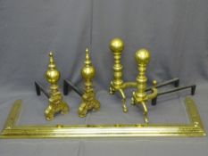 BRASS FIRE DOGS, two substantial pairs, 52cms H and 51cms H, and a brass fender