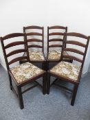 SET OF FOUR MID OAK LADDER-BACK CHAIRS with upholstered drop-in seat pads