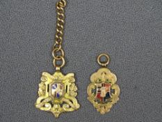 TWO 9CT GOLD & ENAMEL FOOTBALL ASSOCIATION PENDANT FOBS, one marked Birmingham district and Counties