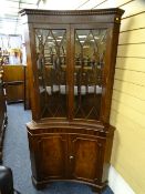 REPRODUCTION CONCAVE CORNER CUPBOARD with dentil cornice, 179cms H, 72cms D