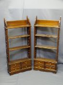 PAIR OF FOUR SHELF OPEN BOOKCASES with fretwork sides and four small base drawers, 110cms H, 50cms