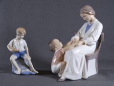 TWO EUROPEAN PORCELAIN FIGURINES including a young seated boy with pond yacht and a woman playing