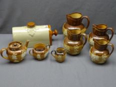 ROYAL DOULTON & OTHER STONEWARE JUGS, three piece teaset and hot water bottle, various
