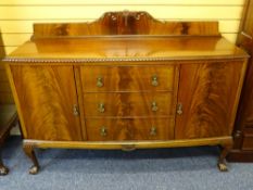 BOW FRONTED RAILBACK SIDEBOARD on ball and claw feet with three central drawers flanked by two