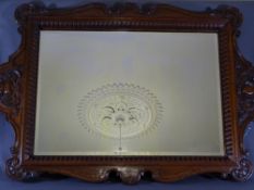 GILLOWS STAMPED OAK FRAMED MIRROR, 118 x 79cms, carved outer details and rib pattern surrounding a
