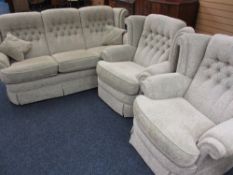 LOUNGE SUITE comprising three seater sofa and two armchairs in a classically patterned pastel