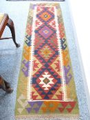 MAIMANA KILIM RUNNER - green and red ground with multicolour central diamond pattern and wave