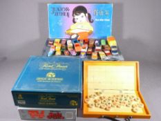 DIECAST VEHICLES in vintage case and a quantity of board games