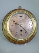 A SHIP'S TYPE CLOCK with metal dial