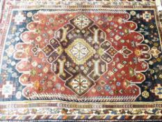 TRADITIONAL EASTERN STYLE RUG - blue and red ground with repeating central block pattern and multi-