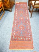 MESHWANI RUNNER - red ground, triple bordered with a repeating diamond central pattern, 240 x 60cms