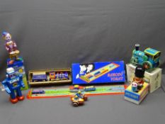 TIN PLATE TOYS, boxed, including a steam locomotive, clown drummer, road roller ETC