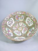 LARGE CANTON DECORATED FAMILLE ROSE BOWL with panels of figures and birds, 46cms diameter (AF)