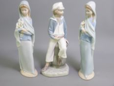 LLADRO - three figurines, girl with a shawl and flowers (two) and a young sailor boy