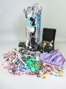 VINTAGE & LATER COSTUME JEWELLERY with a Nokia mobile phone and figural display stand