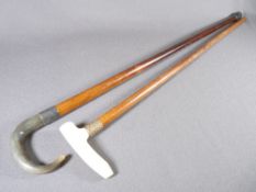 WALKING CANES - one with 9ct gold collar, the other with silver